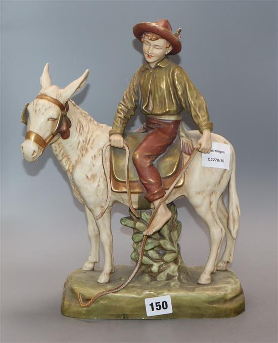A Royal Dux model of a youth riding a donkey